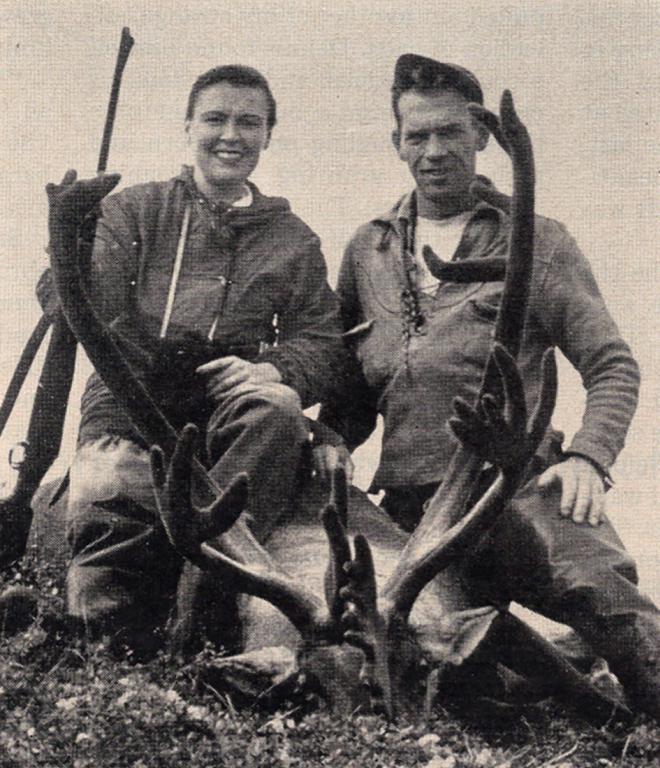 Virginia Kraft and her guide, Dennis Branham, kneel next to her kill, a Barren Ground caribou.