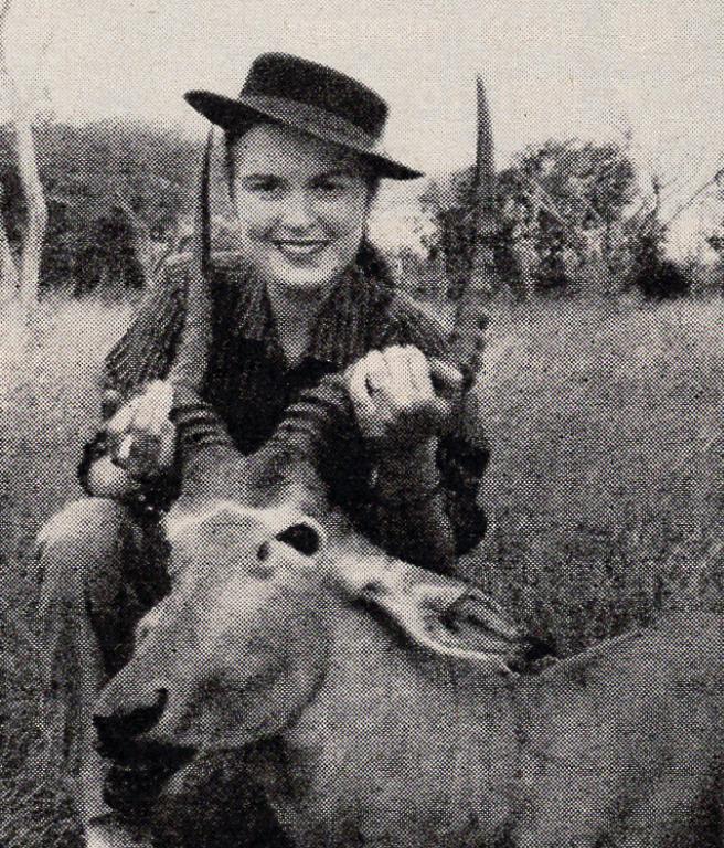 Virginia Kraft holds up the horns of a hartebeest, a type of African antelope.